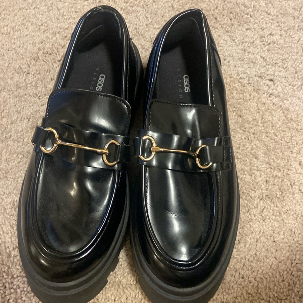 WORN ONLY A FEW TIMES!!! Black loafers with metal detail on front.